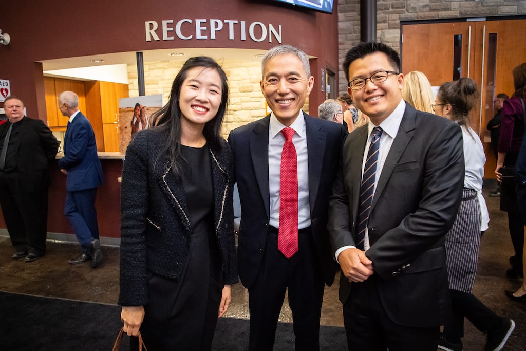 Three guests pose during the pre-event mingling time.